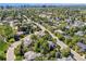 Aerial view showcasing a neighborhood with mature trees and manicured lawns at 9880 E Progress Cir, Greenwood Village, CO 80111