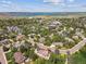 Beautiful aerial view of a neighborhood with lake and city views at 9880 E Progress Cir, Greenwood Village, CO 80111