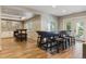 Open basement featuring a bar area, bar stool seating, and entertaining/living room spaces at 9880 E Progress Cir, Greenwood Village, CO 80111