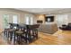 Basement entertainment area showcases a stone fireplace, tv, bar seating and walkout access at 9880 E Progress Cir, Greenwood Village, CO 80111