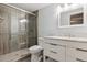 Bathroom features a glass shower with intricate tile work and marbled countertop sink at 9880 E Progress Cir, Greenwood Village, CO 80111