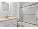 Bright bathroom featuring subway tile, shower and tub combination, and vanity at 9880 E Progress Cir, Greenwood Village, CO 80111