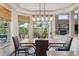 Inviting breakfast nook bathed in natural light with views of the outdoor living space at 9880 E Progress Cir, Greenwood Village, CO 80111