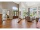Welcoming foyer with a grand entrance, high ceilings, hardwood floors, and a view into the spacious living room at 9880 E Progress Cir, Greenwood Village, CO 80111