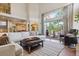Spacious living area with large windows, deck access, and an open floor plan at 9880 E Progress Cir, Greenwood Village, CO 80111
