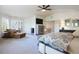 Spacious main bedroom suite with sitting area and TV at 9880 E Progress Cir, Greenwood Village, CO 80111