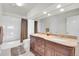 Bathroom featuring double sink vanity, granite countertop, and neutral color palette at 2032 W Nantucket Ct, Littleton, CO 80120