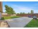 Well-maintained backyard features a concrete patio, grass, and fenced perimeter at 11192 E 7Th Ave, Aurora, CO 80010