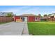 This backyard boasts a concrete patio, lush grass, and privacy fence at 11192 E 7Th Ave, Aurora, CO 80010