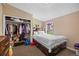 Bright bedroom features a double bed with built in storage and closet space at 11192 E 7Th Ave, Aurora, CO 80010