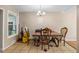 Cozy dining area with tile flooring, classic table and chairs, and natural light from large window at 11192 E 7Th Ave, Aurora, CO 80010