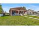 Charming single-story home with covered porch, mature lawn, and easy access walkway to entry door at 11192 E 7Th Ave, Aurora, CO 80010