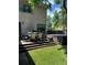 Spacious backyard featuring a well-maintained lawn, hot tub, dining set, and a grill, ideal for outdoor entertainment at 3323 W Hayward Pl, Denver, CO 80211