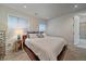 Cozy bedroom featuring a large bed, neutral walls, and ample natural light at 3323 W Hayward Pl, Denver, CO 80211