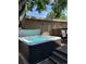 Outdoor hot tub on a wooden deck, nestled in a backyard setting with string lights and mature trees overhead at 3323 W Hayward Pl, Denver, CO 80211
