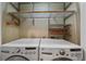 Laundry room featuring a new washer and dryer with shelving above at 3323 W Hayward Pl, Denver, CO 80211