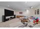 Basement featuring a projector screen, home theatre seating, and shelving at 3323 W Hayward Pl, Denver, CO 80211