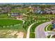 Community featuring a grassy area, playground, park, sidewalks, lush green spaces, and Gathering homes at 10185 Isle St, Parker, CO 80134