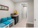 Mudroom includes bench seating, storage cabinets, and access to the garage and powder room at 10185 Isle St, Parker, CO 80134