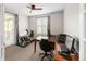 Bright home office includes french doors, large window, and access to outdoor patio area at 10185 Isle St, Parker, CO 80134