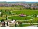 Beautiful park with a red gazebo, lush green spaces, walking paths, a playground, and benches at 10185 Isle St, Parker, CO 80134