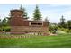 Sierra Ridge Community Sign nestled in a landscaped garden on a sunny day at 10185 Isle St, Parker, CO 80134