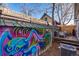 Unique backyard with art and a cozy deck, creating an inviting outdoor space at 723 W 5Th Ave, Denver, CO 80204