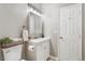 Bathroom with modern vanity, framed mirror, and decorative wall art at 723 W 5Th Ave, Denver, CO 80204