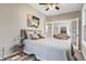 Bright bedroom with French doors offering a peek into the stylish living area at 723 W 5Th Ave, Denver, CO 80204