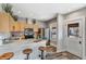 Well-lit kitchen features stainless steel appliances and a breakfast bar with seating, offering a practical and stylish cooking space at 723 W 5Th Ave, Denver, CO 80204