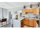 Bright kitchen with a dishwasher and lots of counter space, with dining area and washer-dryer nearby at 723 W 5Th Ave, Denver, CO 80204