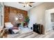 Home office features exposed brick wall, hardwood floors and ceiling fan at 723 W 5Th Ave, Denver, CO 80204