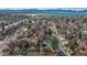 Stunning aerial view of the neighborhood with lake and mountain views in the distance at 9411 W 89Th Cir, Westminster, CO 80021