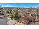 Aerial view of townhomes with attached garages, mature trees, and well-maintained landscaping at 9411 W 89Th Cir, Westminster, CO 80021