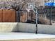 An outdoor basketball court with the hoop and net are ready for recreational play at 9411 W 89Th Cir, Westminster, CO 80021