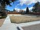 A community basketball court with a bench, a playground, and a wooden fence for recreational activities at 9411 W 89Th Cir, Westminster, CO 80021