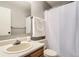 Standard bathroom featuring a large mirror, vanity sink, and a shower with a white curtain at 9411 W 89Th Cir, Westminster, CO 80021