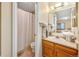 Bathroom offering a shower, new tiled floor, and storage at 9411 W 89Th Cir, Westminster, CO 80021