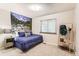 Cozy bedroom with a unique nature mural and ample natural light from the window at 9411 W 89Th Cir, Westminster, CO 80021