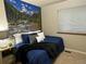 Comfortable bedroom with a serene mural, soft lighting, and plush bedding for relaxation at 9411 W 89Th Cir, Westminster, CO 80021