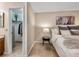 Bedroom featuring a walk-in closet, neutral paint and a view of the updated bathroom at 9411 W 89Th Cir, Westminster, CO 80021