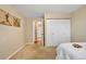 Bedroom featuring artwork, large closet, and natural light at 9411 W 89Th Cir, Westminster, CO 80021