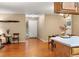 Warm entryway featuring hardwood floors, a charming side table, and a bright front door at 9411 W 89Th Cir, Westminster, CO 80021
