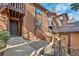 Exterior view of the townhouse featuring a private entrance and well-maintained landscaping at 9411 W 89Th Cir, Westminster, CO 80021