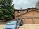 Exterior view of the residence showing the 3-car garage and surrounding yard at 9411 W 89Th Cir, Westminster, CO 80021