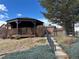 A community gazebo with wooden floors and steps and a beautiful lawn area surrounded by trees at 9411 W 89Th Cir, Westminster, CO 80021