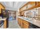 Bright kitchen features light countertops and cabinets, with views to the living spaces at 9411 W 89Th Cir, Westminster, CO 80021