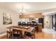 Warm kitchen and dining area featuring a breakfast bar and classic cabinets at 9411 W 89Th Cir, Westminster, CO 80021