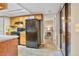 Kitchen features black appliances and a doorway to a bedroom at 9411 W 89Th Cir, Westminster, CO 80021