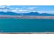 Stunning lake view with scenic mountains in the background at 9411 W 89Th Cir, Westminster, CO 80021